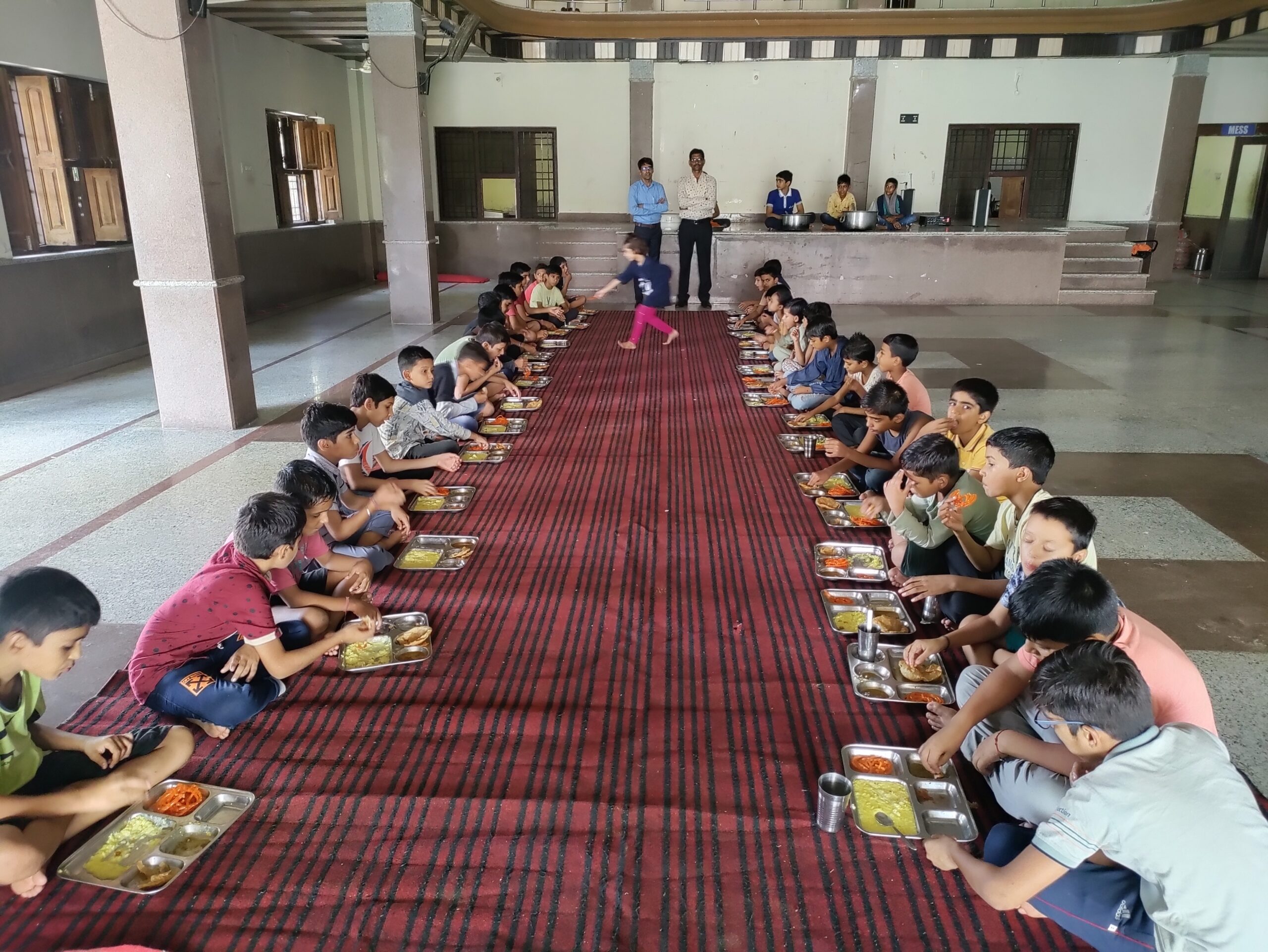 IPS Academy Ratangarh students having a meal together in the residential dining area